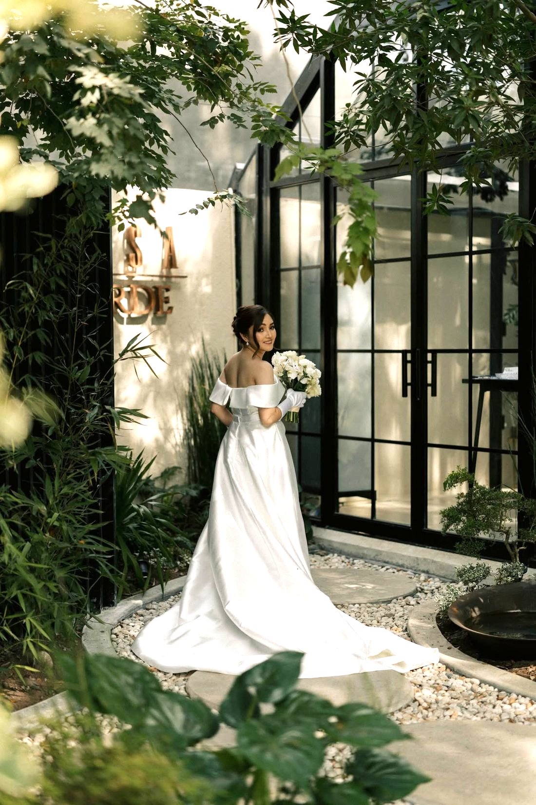 A bride beside the garden windows at Casa Verde