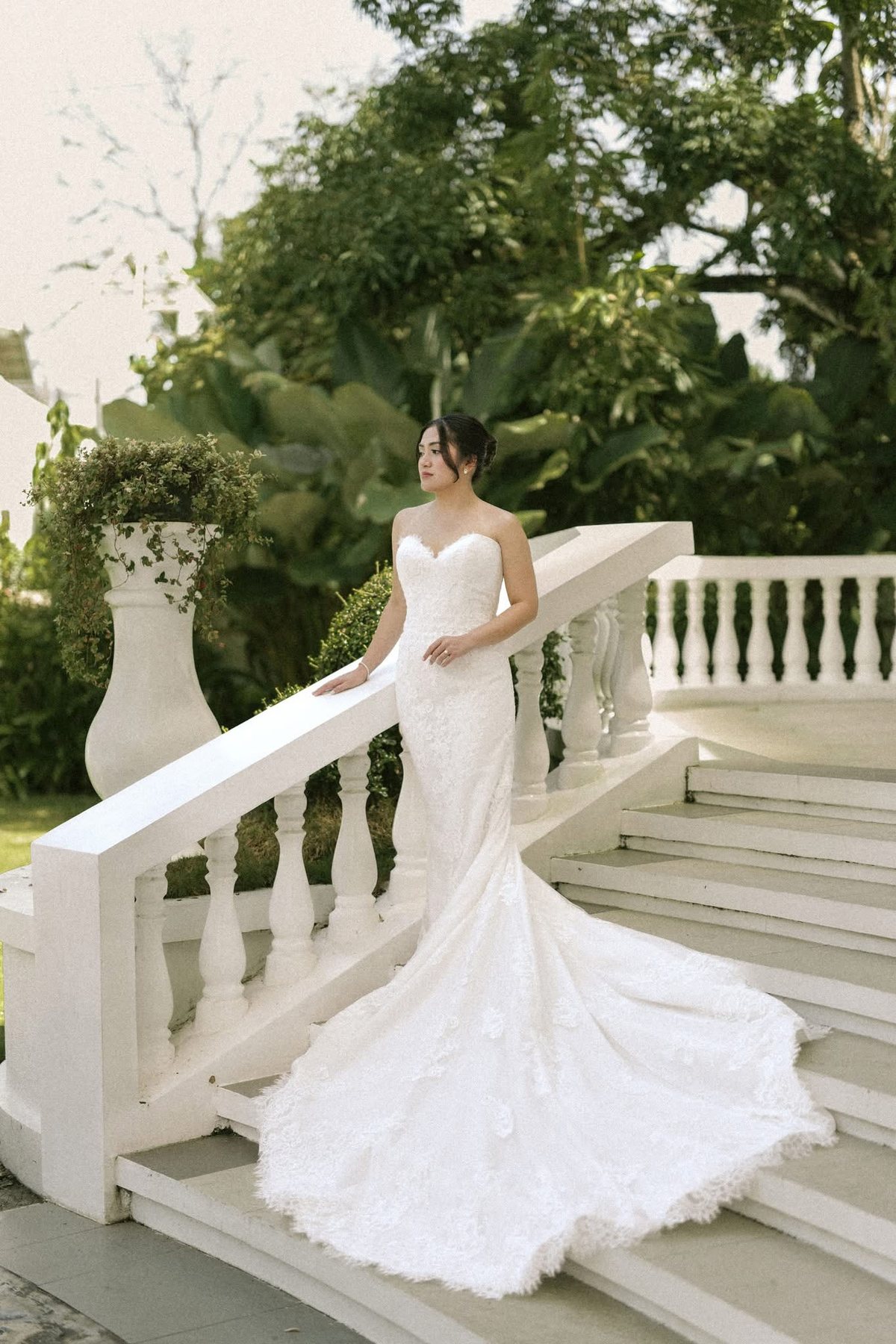 A bride on the garden steps